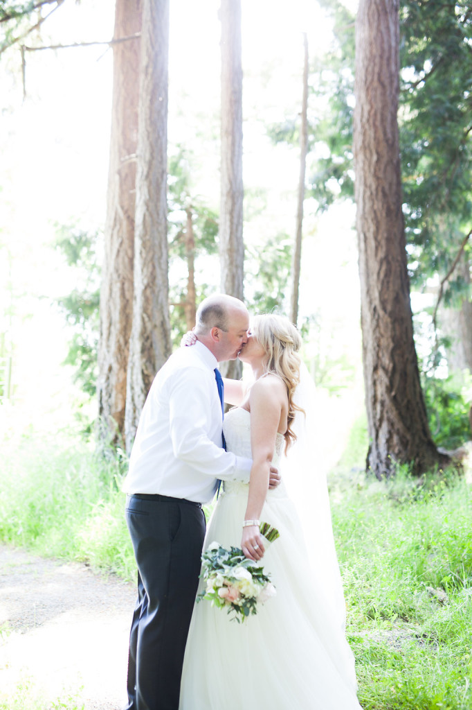 forest wedding bride and groom kiss