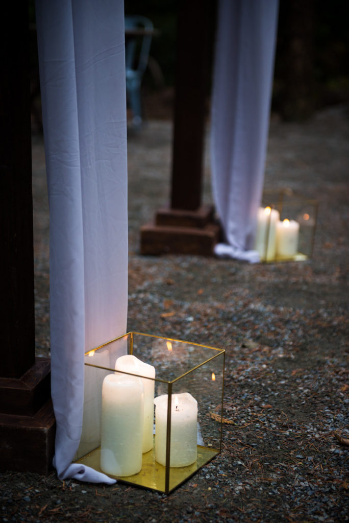 gold boxes filled with pillar candles